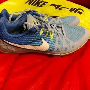 Nike Racing cleats and trendy yellow shoe bag